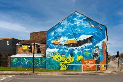 Building with a boat and trawlermen painted on
